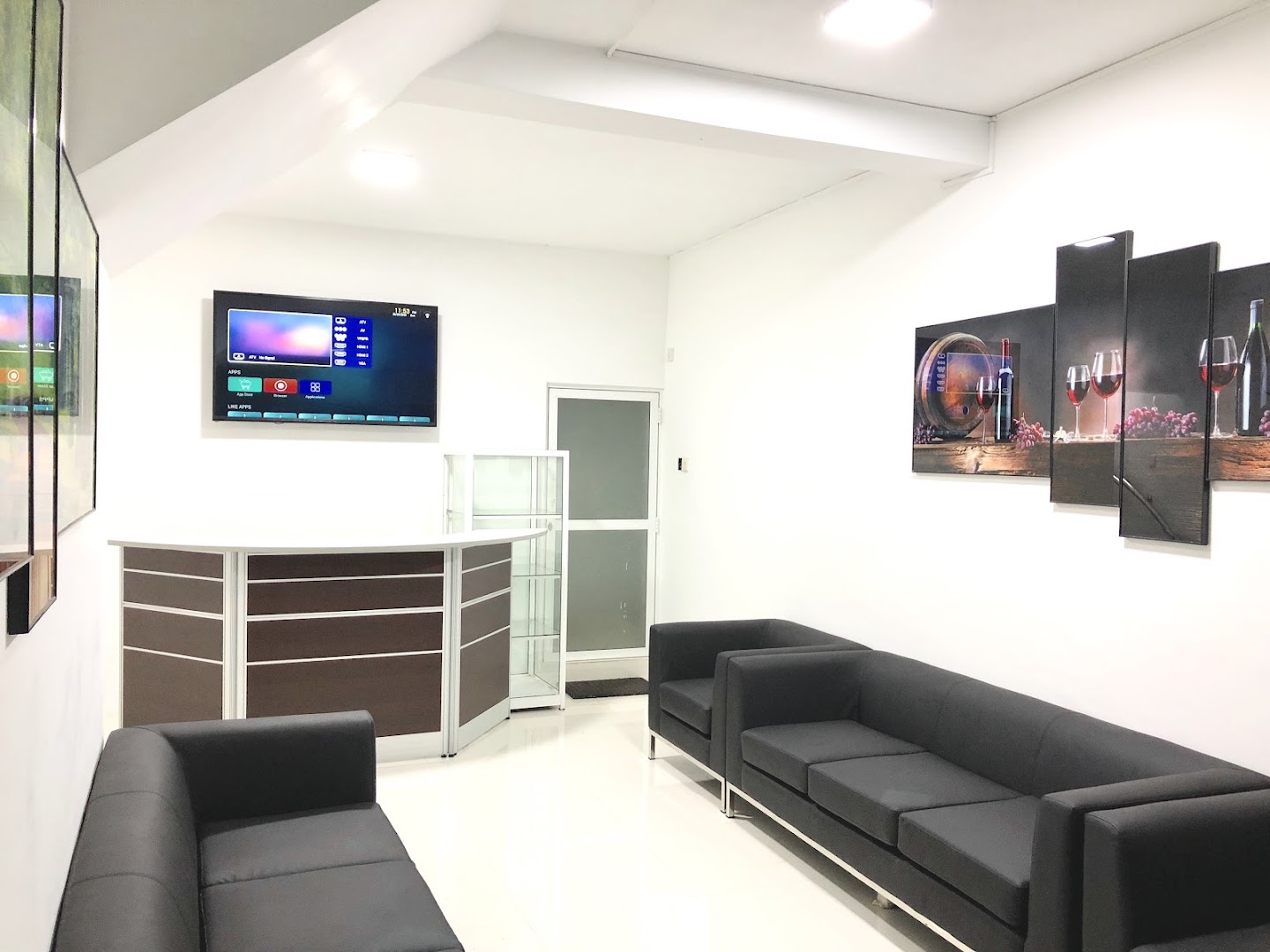 Bright reception and waiting room with dark seating
